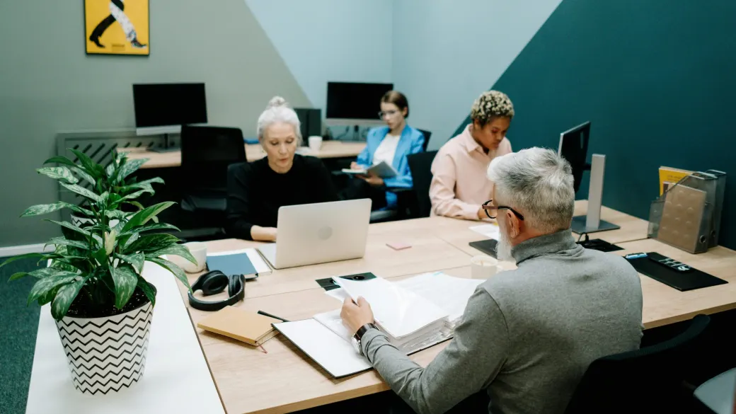 A team at work at their own desks in an open-plan office.